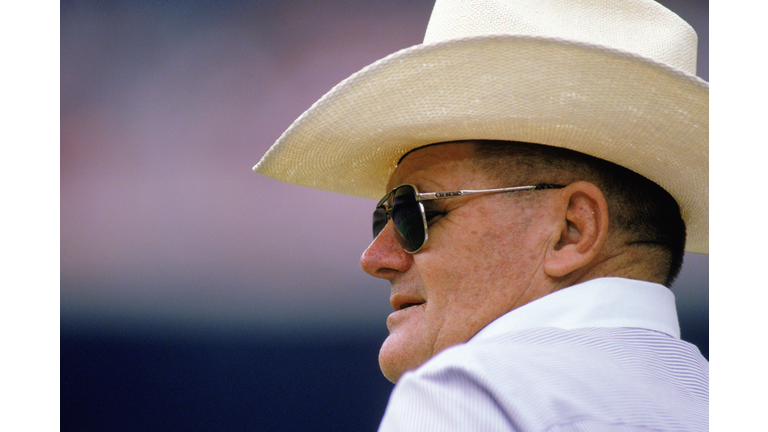 Bum Phillips stands on the sideline