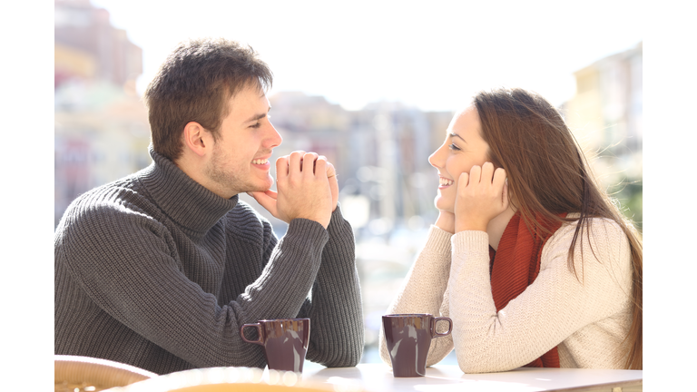 Couple dating and flirting looking each other