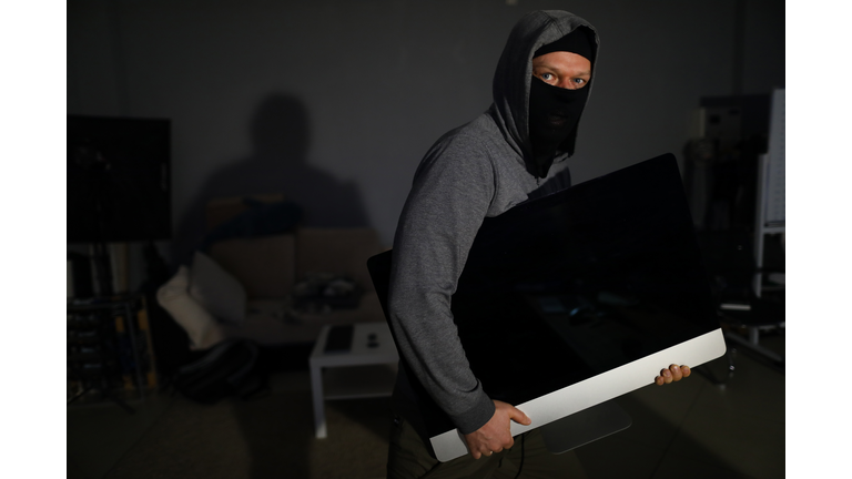 Thief stealing electronics