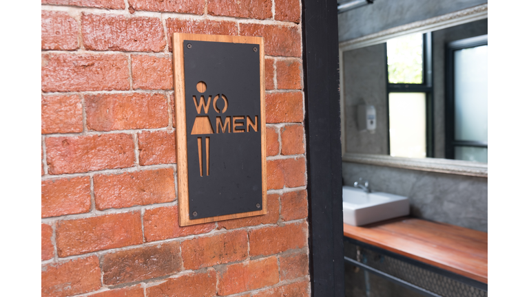 Public restroom or toilet with women signs on brick wall decorate by vintage style in department store