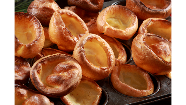 Yorkshire Pudding on Baking Tray with wood and decorative festive background