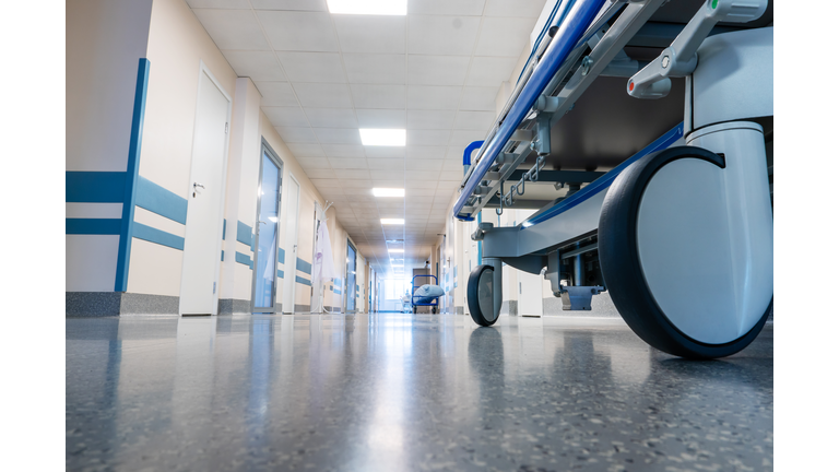 Medical bed on wheels in the hospital corridor.