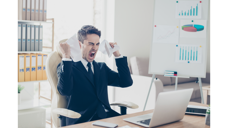 Aggressive irritated despair nervous fury people overworking tiredness workpaper person concept. Portrait of sad upset yelling screaming unsatisfied agent holding contract sitting on armchair