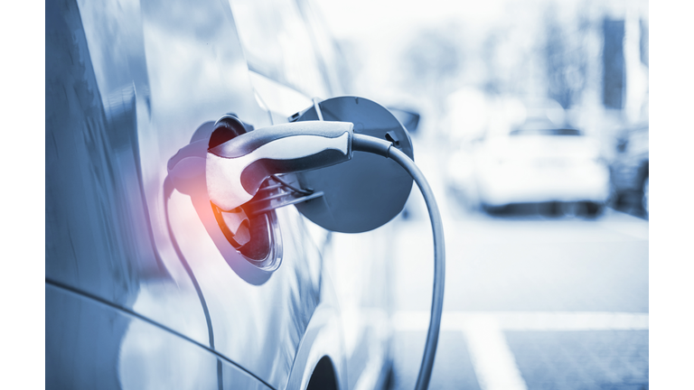 Electric Car Charging At Power Station
