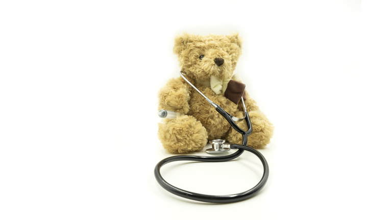 doctor brown bear with stethoscope on isolate background