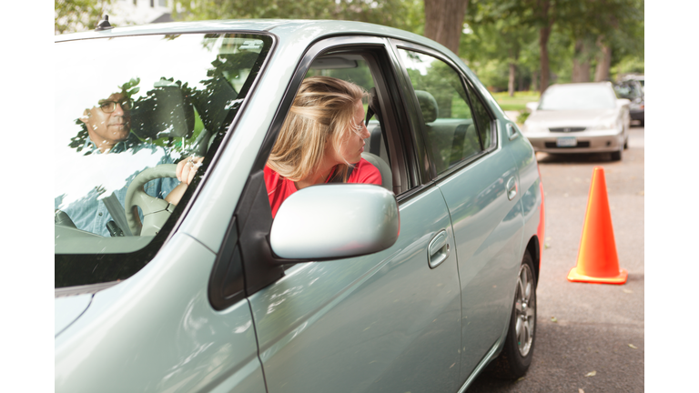 Teen Driver Learning Parallel Parking with Driving Instructor and Cone