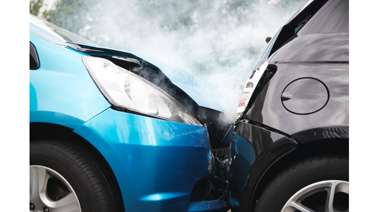 Close Up Of Two Cars Damaged In Road Traffic Accident