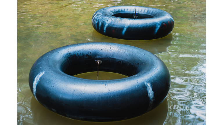 Old inner tubes floating on a river