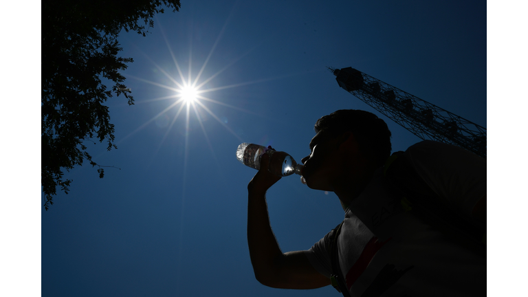Man drinking water on a hot summer day 