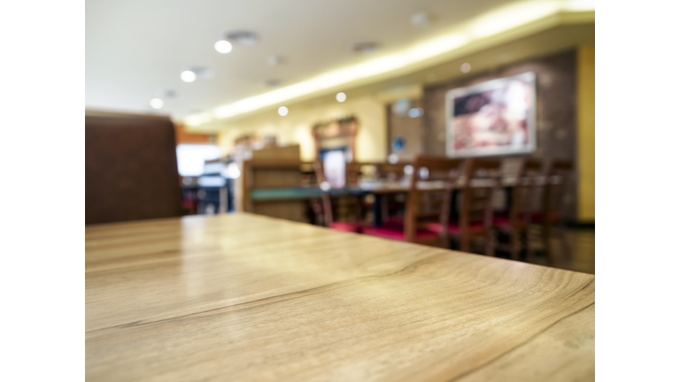 Wooden Table top with Blurred Restaurant Background