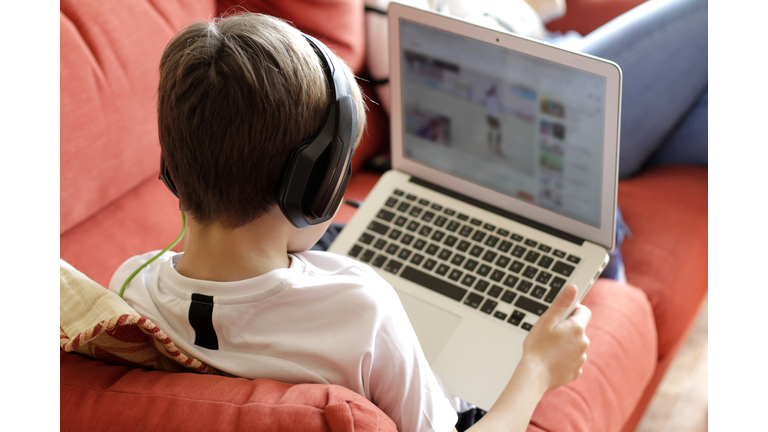 Boy Playing Video Game On Computer