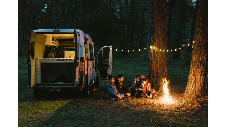 Friends camping near the forest