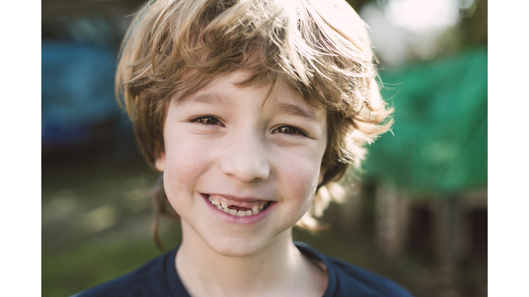 Portrait of blond boy with a big smile