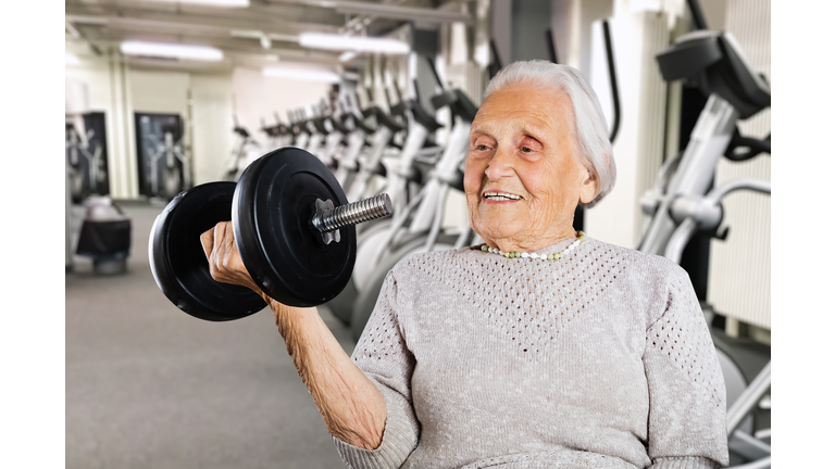 Strong Retired Grandmother Women Lifting Weight