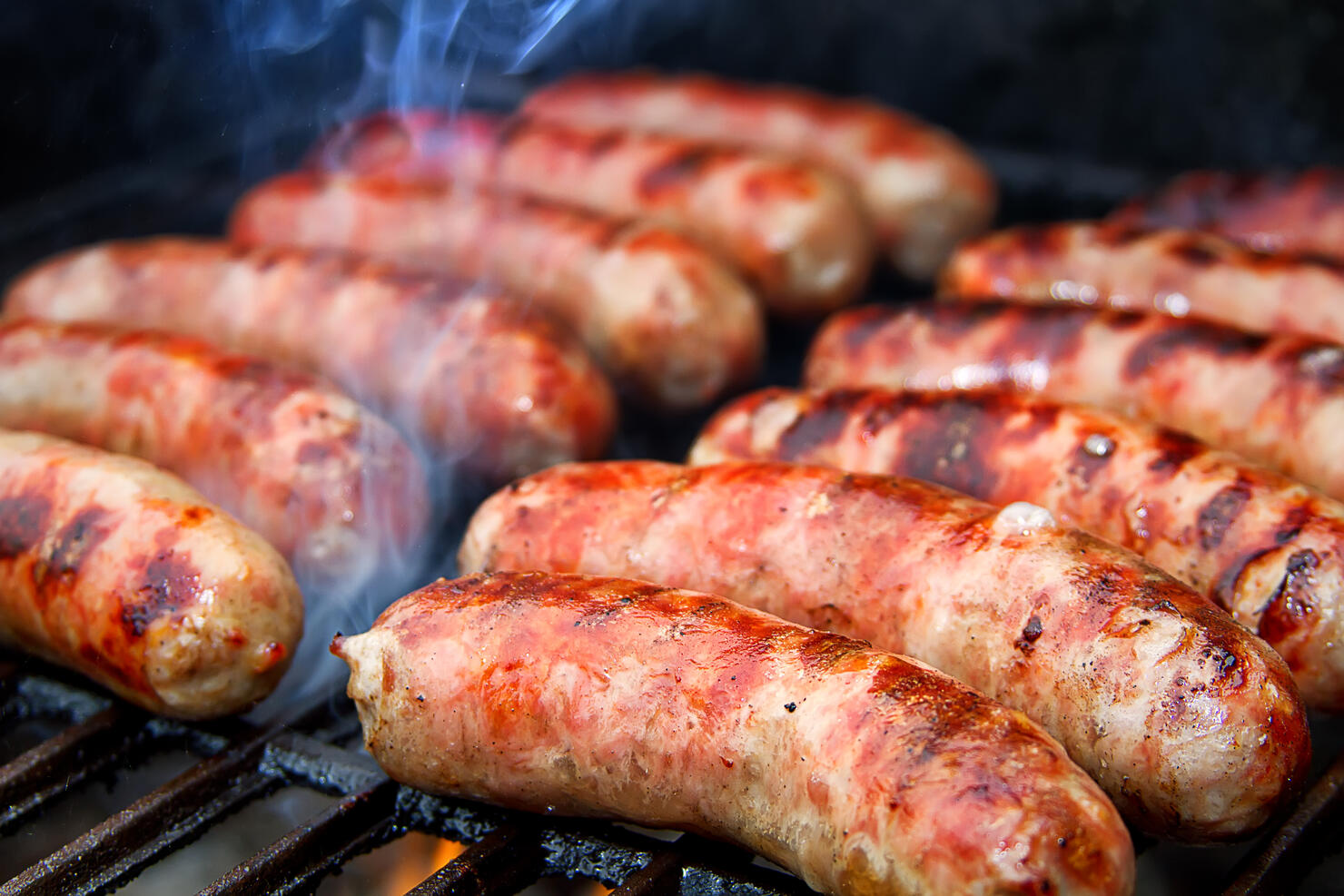 Bratwurst sausages on grill.