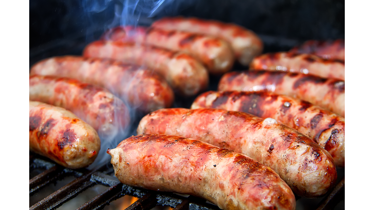 Bratwurst sausages on grill.