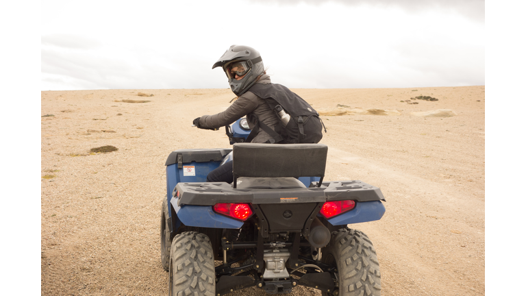 Woman riding ATV in Argentina