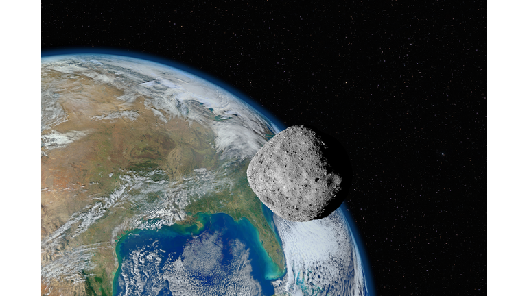 Asteroid approaching planet Earth, elements of this image furnished by NASA