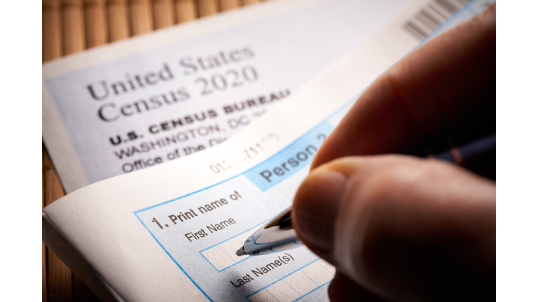 Census 2020: survey questionnaire form on desk with pen