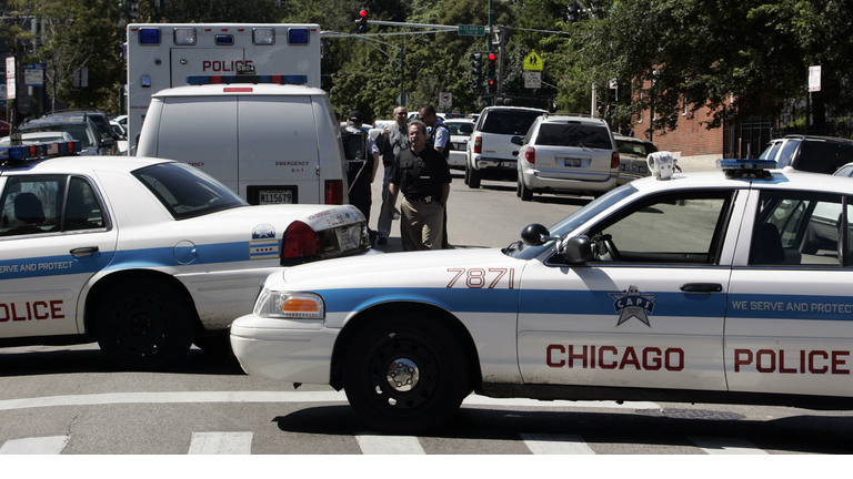Chicago police block a street during a s
