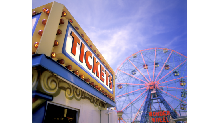 Ticket booth and ferris wheel at Coney Island