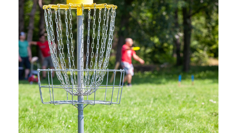 People playing flying disc sport game in the park