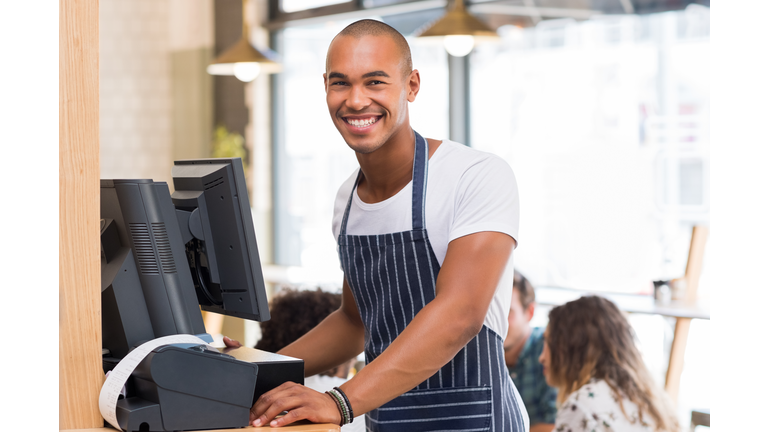 Smiling young waiter