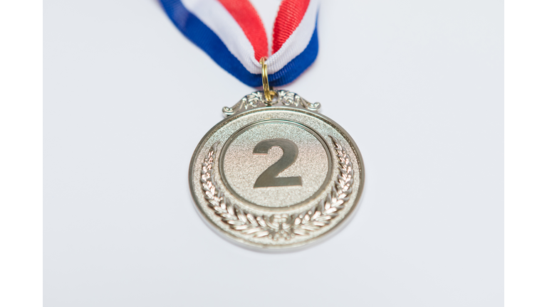 Silver medal of sporting achievement for the second classified, on white background. Olympic games and sport concept