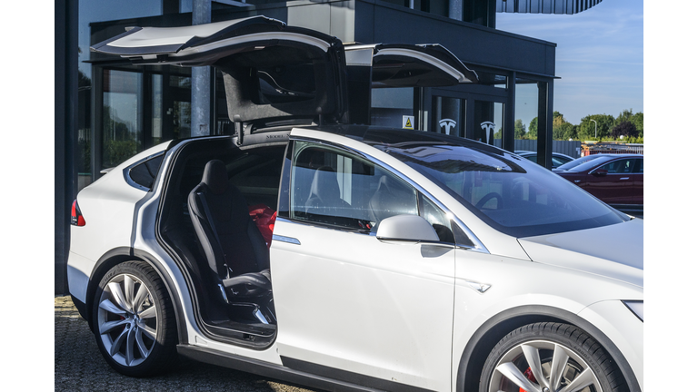 Tesla Model X crossover SUV with open falcon wing doors