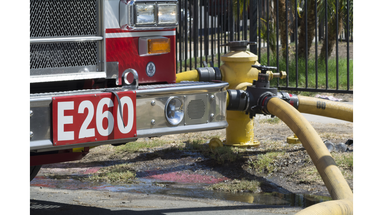 Fire engine and hydrant with fire hose