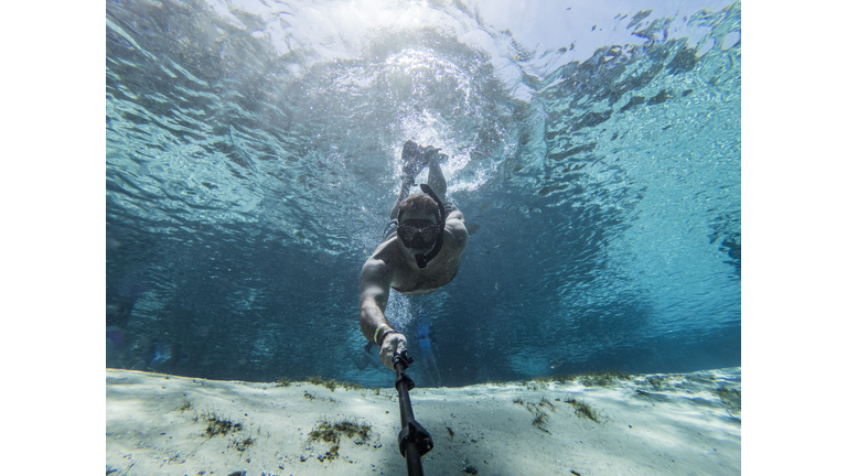 Snorkeling man underwater