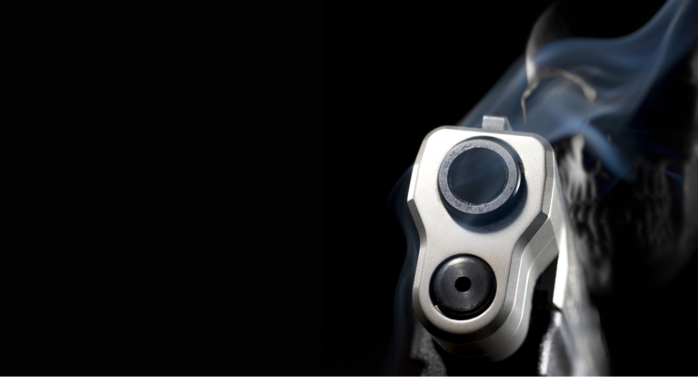 3D illustration of a ghost gun with smoking pistol in front and skull behind on a black background