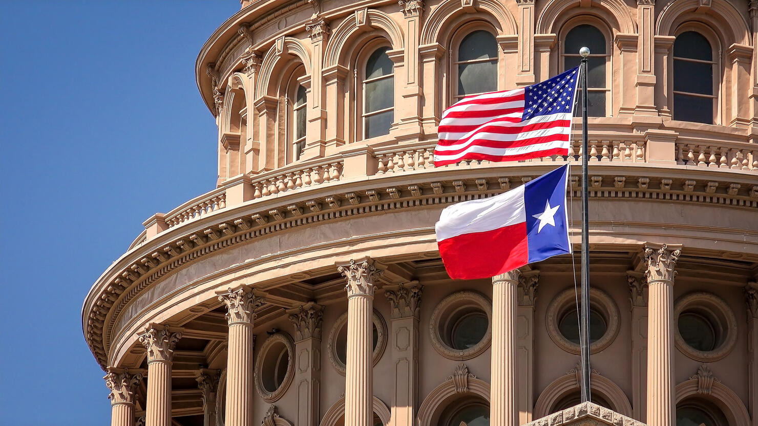 American and Texas Flag Flying, Texas State Capitol in Austin