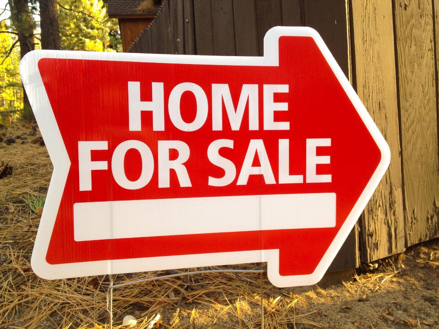 For Sale Arrow Sign On Ground