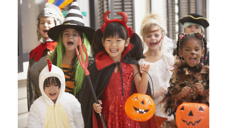 Group of children dressed up in costumes for Halloween