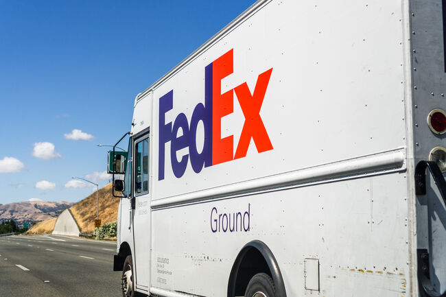 FedEx truck driving on the freeway