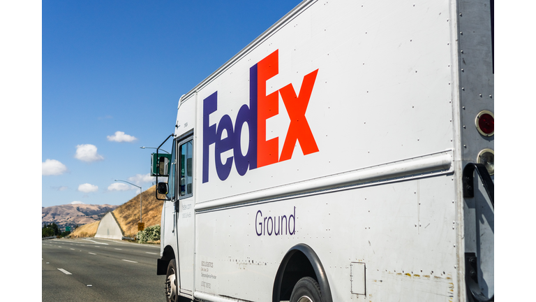 FedEx truck driving on the freeway
