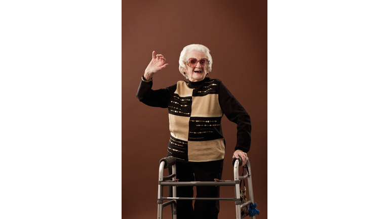 Senior woman with walker dancing