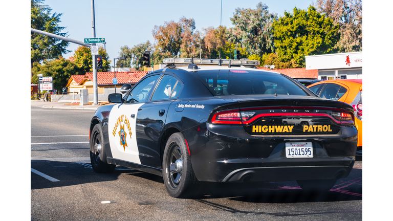 Highway Patrol vehicle driving on a street