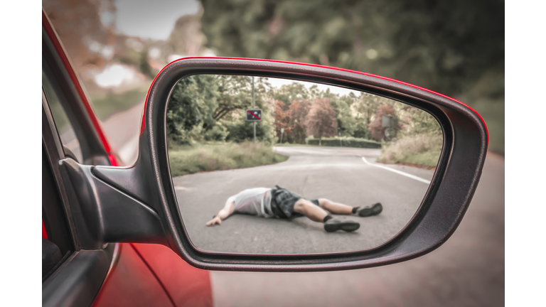 Rearview mirror with a man hit by a car