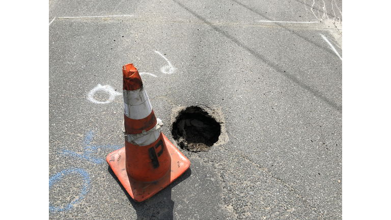 Pot hole in roadway creating a hazard to motorists