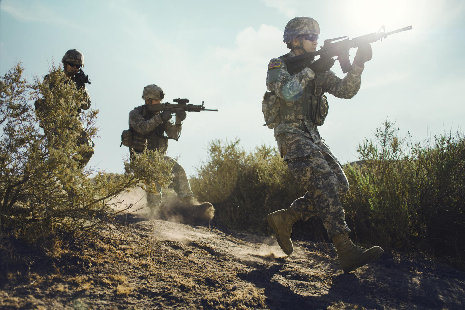 Army soldiers advancing in combat.