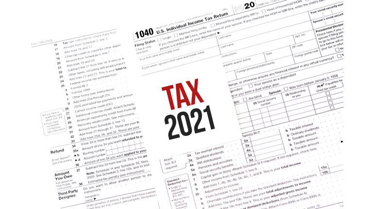 White Paper Note With Words TAX 2021 On Calendar