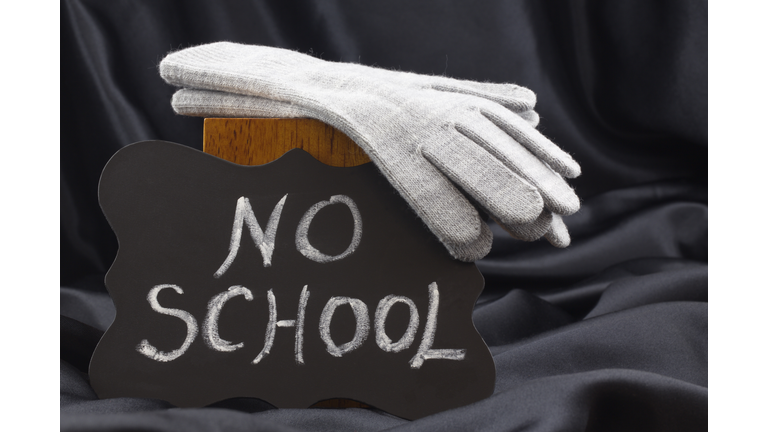 NO SCHOOL sign on chalkboard warns of cold weather closing