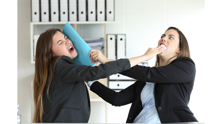 Two angry executives fighting at office