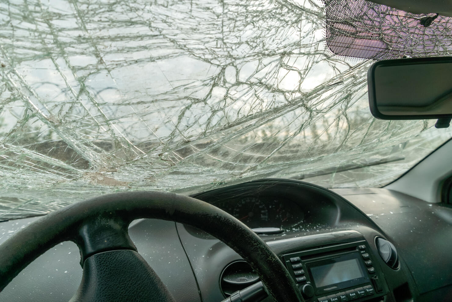 BROKEN CAR AFTER THE ACCIDENT, BROKEN GLASS. VIEW FROM THE SALON. INSIDE.