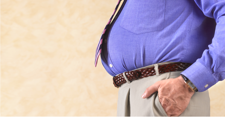 Overweight businessman with copy space