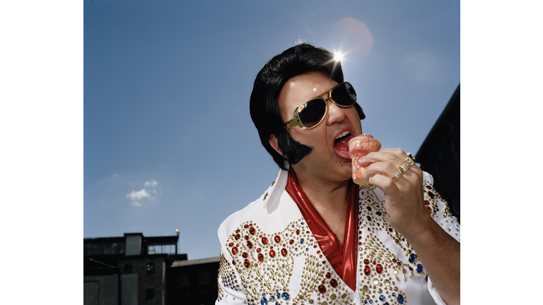 Celebrity impersonator eating ice cream cone