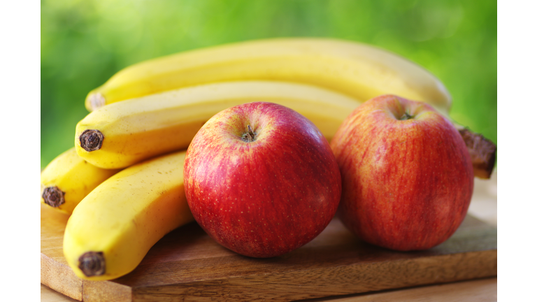 Close-Up Of Apples And Bananas On Table