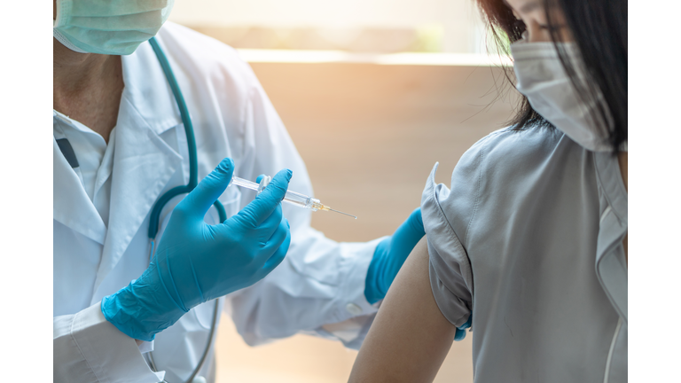 Immunization and vaccination for flu shot, influenza, HPV or Covid-19 prevention with young child girl having vaccine injection for World immunization week and International HPV awareness day